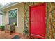 Inviting front entrance with a vibrant red door at 3447 Tallywood Ln # 7143, Sarasota, FL 34237