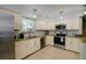 Open concept kitchen with stainless steel appliances and granite countertops at 3447 Tallywood Ln # 7143, Sarasota, FL 34237