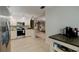 Open kitchen showcasing stainless steel appliances and granite countertops at 3447 Tallywood Ln # 7143, Sarasota, FL 34237