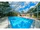 Inviting screened-in pool area with ample deck space at 3447 Tallywood Ln # 7143, Sarasota, FL 34237