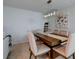 Elegant dining room with a wood table and six beige chairs at 3447 Tallywood Ln # 7143, Sarasota, FL 34237