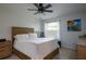 Spacious bedroom with wooden bed frame and lots of natural light at 3447 Tallywood Ln # 7143, Sarasota, FL 34237