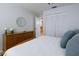 Bright bedroom with wood dresser and built-in closet at 3447 Tallywood Ln # 7143, Sarasota, FL 34237