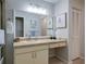 Clean bathroom with single vanity and a linen closet at 3447 Tallywood Ln # 7143, Sarasota, FL 34237