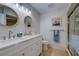 Updated bathroom with double sinks, modern fixtures, and a walk-in shower at 3447 Tallywood Ln # 7143, Sarasota, FL 34237