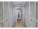 Clean bathroom with double vanity and access to the bedrooms at 3447 Tallywood Ln # 7143, Sarasota, FL 34237