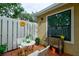 Relaxing patio area with table, chairs, and lush greenery at 3447 Tallywood Ln # 7143, Sarasota, FL 34237