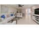 Spacious living room with white sofas, a glass coffee table, and view of dining area at 3447 Tallywood Ln # 7143, Sarasota, FL 34237