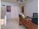 Home office features a large desk, ample storage, and a ceiling fan at 3447 Tallywood Ln # 7143, Sarasota, FL 34237