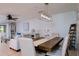 Bright dining room with wood table and chairs, adjacent to living room at 3447 Tallywood Ln # 7143, Sarasota, FL 34237