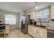 Bright kitchen featuring stainless steel appliances and granite countertops at 3447 Tallywood Ln # 7143, Sarasota, FL 34237