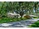 Exterior of home with carport and landscaping at 3447 Tallywood Ln # 7143, Sarasota, FL 34237