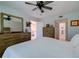 Main bedroom with large dresser, access to a second bathroom, and a calm atmosphere at 3447 Tallywood Ln # 7143, Sarasota, FL 34237