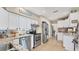 Well-equipped kitchen featuring stainless steel appliances, granite countertops, and white cabinetry at 401 28Th W St, Bradenton, FL 34205