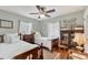 Charming bedroom with twin beds, built-in shelving and hardwood floors at 401 28Th W St, Bradenton, FL 34205
