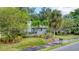 Gray house with palm trees and well-maintained landscaping at 401 28Th W St, Bradenton, FL 34205