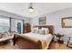 King-size bed in a spacious main bedroom with patio access and dresser at 401 28Th W St, Bradenton, FL 34205