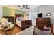 Cozy bedroom with a full-size bed, dresser, and charming decor at 401 28Th W St, Bradenton, FL 34205