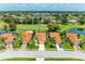 Community overview showing several homes with tile roofs and golf course views at 5042 Clubview E Ct, Bradenton, FL 34203