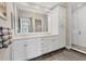 Elegant bathroom with double vanity, large mirror, and walk-in shower at 10520 Boardwalk Loop # 605, Lakewood Ranch, FL 34202