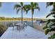 Community grilling station with seating area overlooking the lake at 10520 Boardwalk Loop # 605, Lakewood Ranch, FL 34202