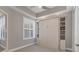 Functional bedroom with a built-in murphy bed and storage at 10520 Boardwalk Loop # 605, Lakewood Ranch, FL 34202