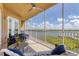 Spacious screened balcony overlooking a lake and golf course at 10520 Boardwalk Loop # 605, Lakewood Ranch, FL 34202