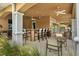Community outdoor bar with seating and fans, perfect for relaxing at 10520 Boardwalk Loop # 605, Lakewood Ranch, FL 34202