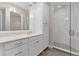 Bright bathroom with a single vanity, walk-in shower, and ample storage at 10520 Boardwalk Loop # 605, Lakewood Ranch, FL 34202