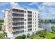 Lakefront condo building with balconies and screened porches at 10520 Boardwalk Loop # 605, Lakewood Ranch, FL 34202