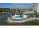 Relaxing pool area with lake views and a clubhouse at 10520 Boardwalk Loop # 605, Lakewood Ranch, FL 34202