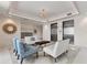 Elegant condo lobby with seating area and modern elevators at 10520 Boardwalk Loop # 605, Lakewood Ranch, FL 34202