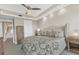 Spacious bedroom with a king-size bed and ensuite bathroom access at 10520 Boardwalk Loop # 605, Lakewood Ranch, FL 34202