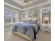 Serene bedroom with a king-size bed and stunning water views at 10520 Boardwalk Loop # 605, Lakewood Ranch, FL 34202