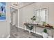 Stylish condo entry with modern console table at 10520 Boardwalk Loop # 605, Lakewood Ranch, FL 34202