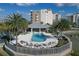 Resort-style pool with surrounding lounge chairs and lake views at 10520 Boardwalk Loop # 605, Lakewood Ranch, FL 34202