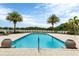 Inviting resort-style pool with plenty of lounge chairs and beautiful landscaping at 10520 Boardwalk Loop # 605, Lakewood Ranch, FL 34202
