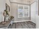 Bright condo entry with wood-look floors and window at 10520 Boardwalk Loop # 605, Lakewood Ranch, FL 34202