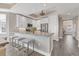 Modern kitchen with white cabinets and granite island at 10520 Boardwalk Loop # 605, Lakewood Ranch, FL 34202