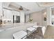 Modern kitchen features a breakfast bar with white quartz countertops at 10520 Boardwalk Loop # 605, Lakewood Ranch, FL 34202