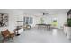 Spacious game room with ping pong table, seating area, and room for bikes at 9975 Key Haven Rd, Seminole, FL 33777