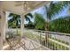 Private balcony overlooking lush tropical landscaping and a tree-lined street at 3412 79Th Street W Cir # 101, Bradenton, FL 34209