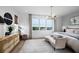 Spacious main bedroom with large windows and plush bedding at 9973 Key Haven Rd, Seminole, FL 33777