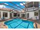 Resort-style pool and spa with covered patio at 3548 Founders Club Dr, Sarasota, FL 34240