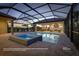 Relaxing pool and spa area with covered lanai at 18138 Home Run Dr, Venice, FL 34293