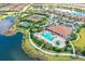 Aerial view of community featuring lakes, pools, tennis courts, and lush landscaping at 12663 Fontana Loop, Bradenton, FL 34211