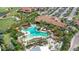 Aerial view of resort style community pool, palm trees, and ample seating at 12663 Fontana Loop, Bradenton, FL 34211