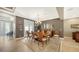Formal dining room with a chandelier, large dining table, and view to outdoor seating at 12663 Fontana Loop, Bradenton, FL 34211