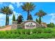 A stone sign for Esplanade Golf & Country Club at Lakewood Ranch surrounded by manicured green landscaping at 12663 Fontana Loop, Bradenton, FL 34211