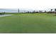 Lush golf course with a pristine green and flag, inviting golfers for a challenging and enjoyable experience at 12663 Fontana Loop, Bradenton, FL 34211
